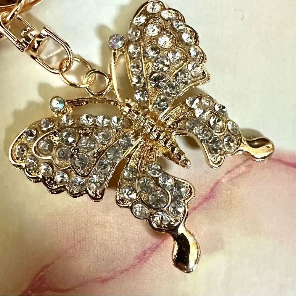 Gold tone butterfly rhinestone hang tag/keychain